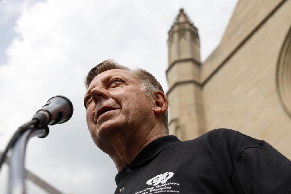 Father Michael Pfleger speaks for first time during a press conference after his reinstatement as the senior pastor at St. Sabina Church by Archdiocese of Chicago, Monday, May 24, 2021 at St. Sabina Catholic Church in the Auburn Gresham neighborhood in Chicago. (AP Photo/Shafkat Anowar) Parishioners of St. Sabina Catholic Church cheers as Father Michael Pfleger speaks for first time during a press conference after his reinstatement as the senior pastor at St. Sabina Church by Archdiocese of Chicago, Monday, May 24, 2021, at St. Sabina Catholic Church in the Auburn Gresham neighborhood in Chicago. (AP Photo/Shafkat Anowar) Parishioners of St. Sabina Catholic Church cheers as Father Michael Pfleger speaks for first time during a press conference after his reinstatement as the senior pastor at St. Sabina Church by Archdiocese of Chicago, Monday, May 24, 2021, at St. Sabina Catholic Church in the Auburn Gresham neighborhood in Chicago. (AP Photo/Shafkat Anowar) Father Michael Pfleger stands among supporters before a news conference outside St. Sabina Church, after the Archdiocese of Chicago announced that Pfleger will return to his role at senior pastor at at the Auburn Gresham church, Monday afternoon, May 24, 2021. The archdiocese cleared him to return after an internal probe into decades-old allegations of sexual abuse against minors. (Ashlee Rezin Garcia/Chicago Sun-Times via AP) Father Michael Pfleger embraces Jordan-Amman Isiah West-Williams, 9, who was baptized by Father Pfleger, following his reinstatement by Archdiocese of Chicago, Monday, May 24, 2021, in front of St. Sabina Catholic Church in the Auburn Gresham neighborhood in Chicago. (AP Photo/Shafkat Anowar)