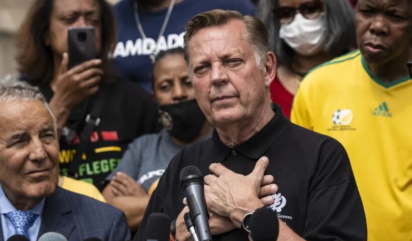 Rev. Michael Pfleger speaks Monday outside his St. Sabina Church after it was announced that he will return to his role as senior pastor after being cleared of sexual abuse allegations. Ashlee Rezin Garcia/Sun-Times