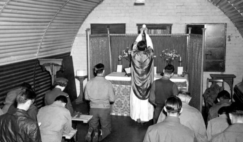 The Rev. Edmund Skoner, a Catholic priest recently placed on the Archdiocese of Chicago’s list of credibly accused clergy, celebrates mass with troops during World War II, during which time he served as a U.S. military chaplain. American Air Museum in Britain