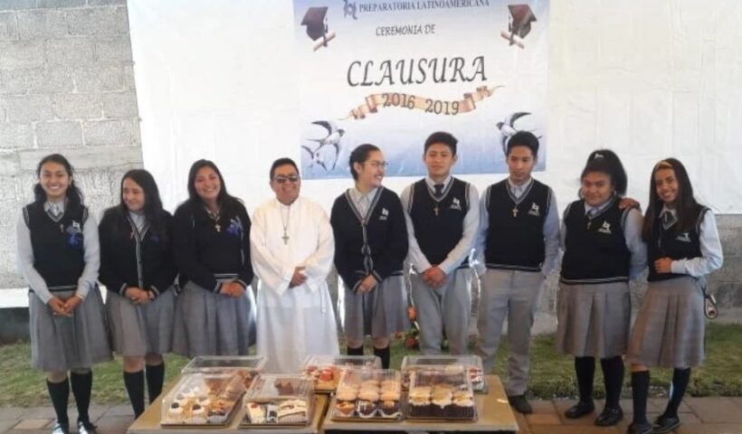 Flores Martínez, at center in white, with minors during a party in Tlaxcala, Mexico, before the pandemic, 2019.