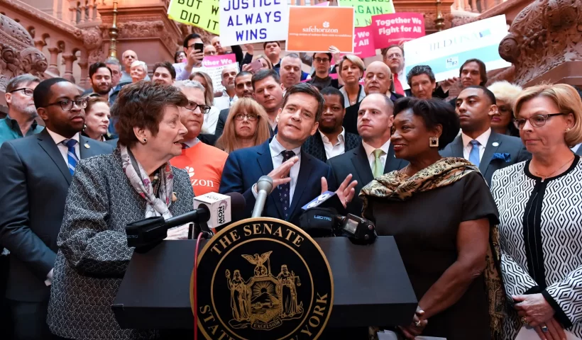 Ms. Markey in 2019 at a rally outside the State Capitol in Albany in support of the Child Victims Act. She appeared alongside State Senator Brad Hoylman-Sigal, Democrat of Manhattan, and Andrea Stewart-Cousins, second from right, the Senate majority leader and Democrat of Yonkers.Credit...Hans Pennink/Associated Press